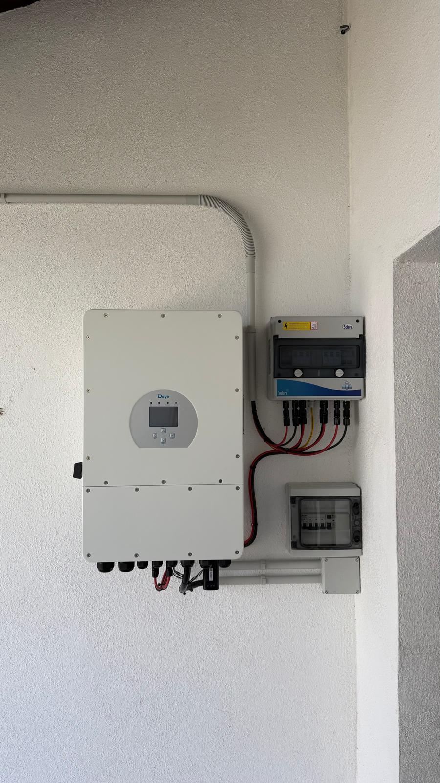 Deye SUN-10K hybrid inverter in the utility room — battery terminals pre-wired for 9.6kWh LiFePO4; MPPT data confirmed on commissioning.