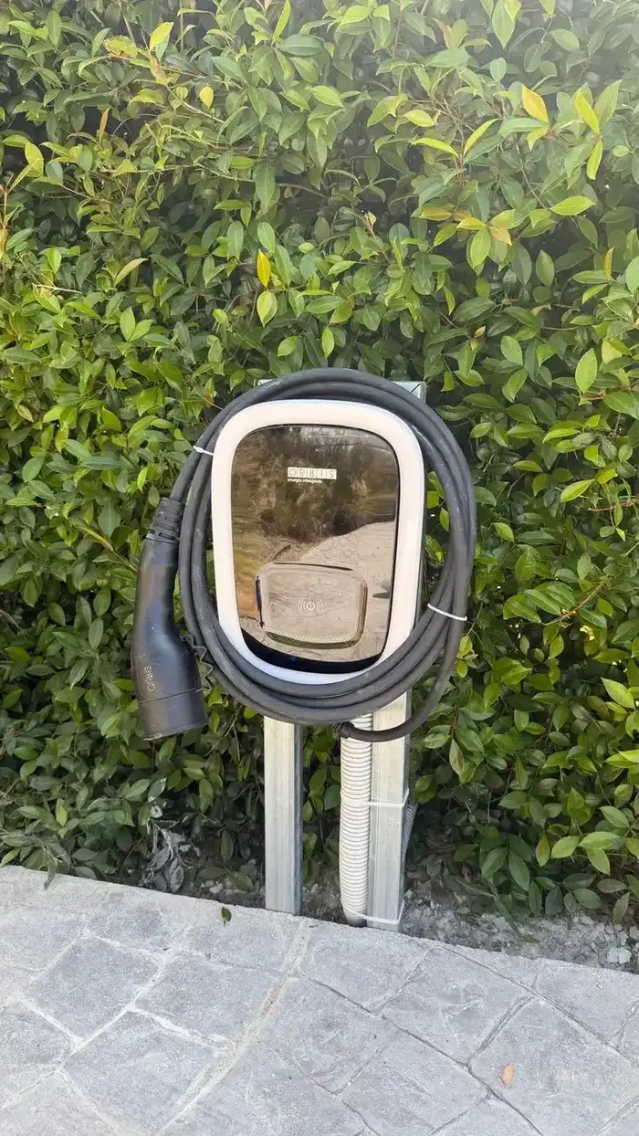 Orbis Viaris Uni 7.4 kW single-phase EV charger on a bespoke galvanised garden pedestal at a villa in San Pedro de Alcántara, Marbella